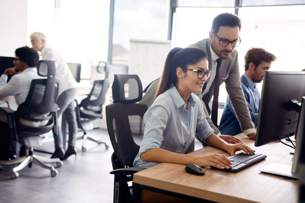 Promenta team collaborating on SAP work in a modern office
